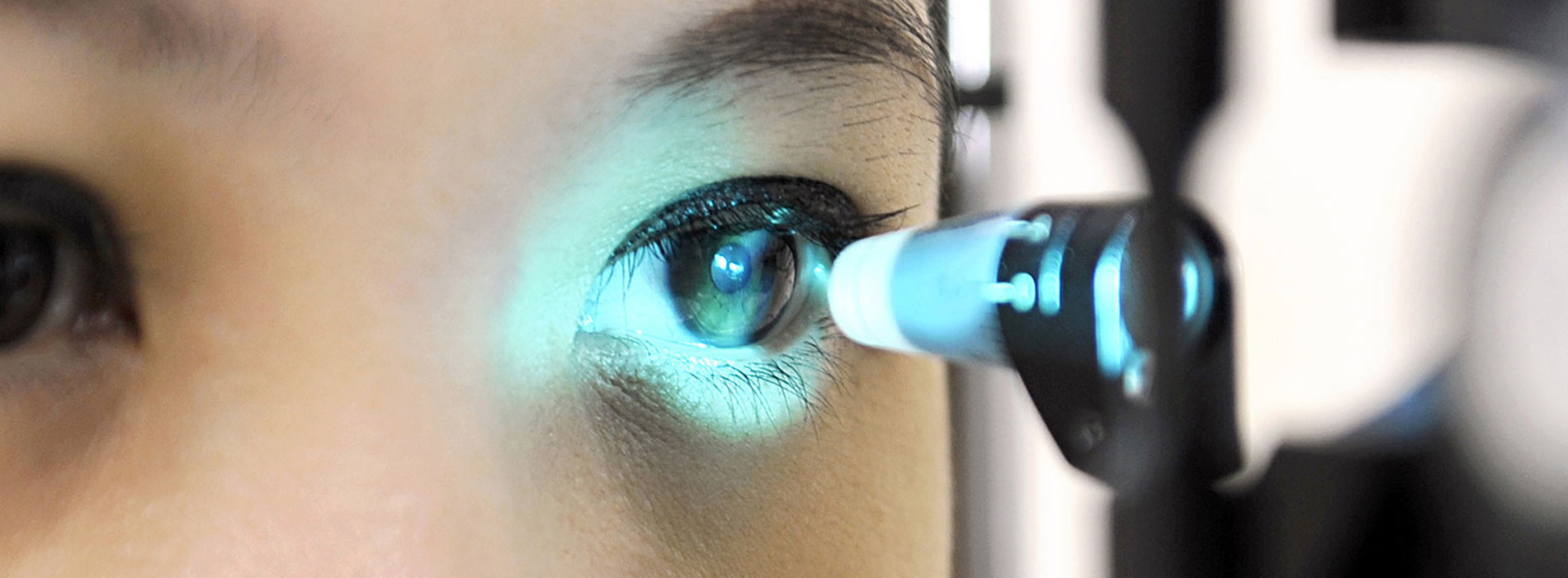 An image of a person using an eye scanner, focusing on the device capturing their eyes.